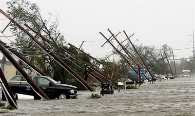 Powerline poles nearly pushed to the ground by Hurricane Katrina
