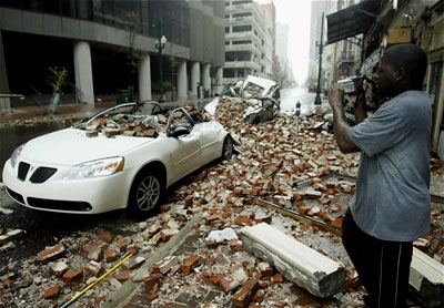 A Hurricane Katrina survivor takes video of the aftermath