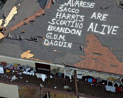 The names of survivors are painted on a roof